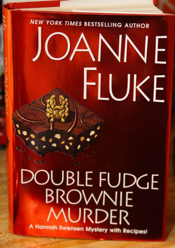 thumbnail interactive-video image 1 of Double Fudge Brownie Murder (Hannah Swensen Mystery) By Joanne Fluke – Hardcover 1 of 2