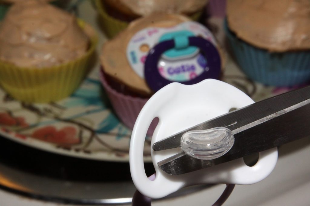 baby face cupcakes with pacifier