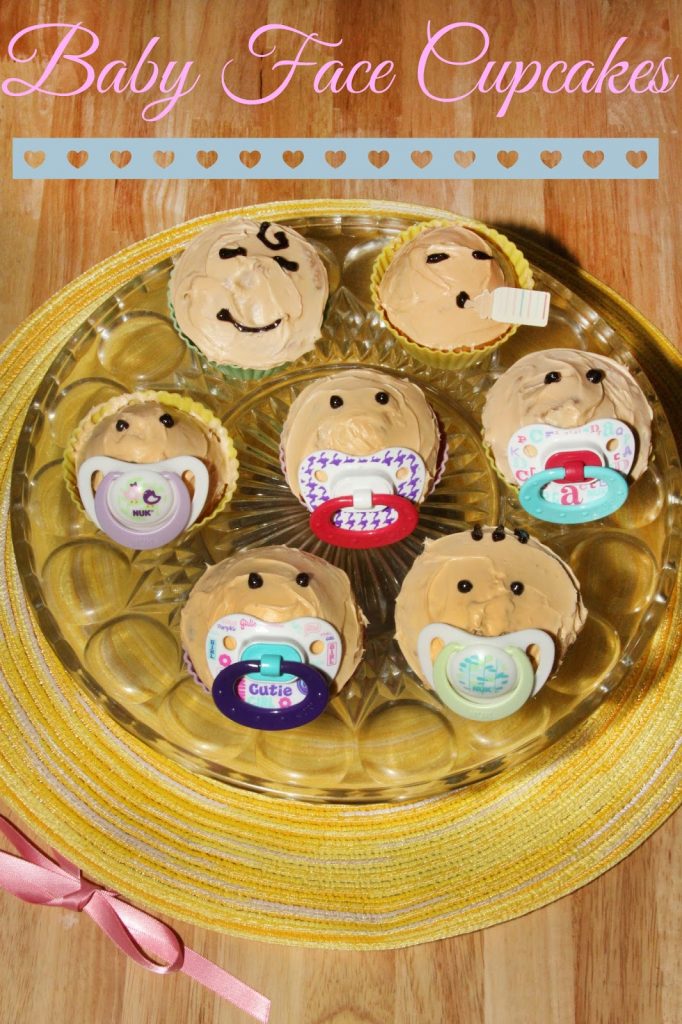 baby face cupcakes with pacifier